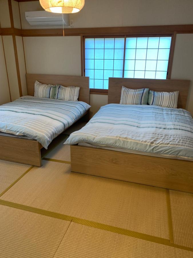 Guest House Apple Ōsaka Extérieur photo