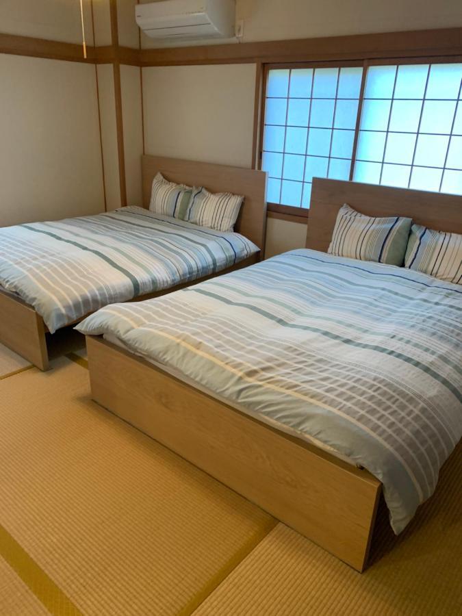 Guest House Apple Ōsaka Extérieur photo
